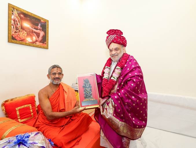 Amit Shah meets revered saint of Pejawar Mutt, Sri Vishwaprasanna Teerth Swami Ji in New Delhi today